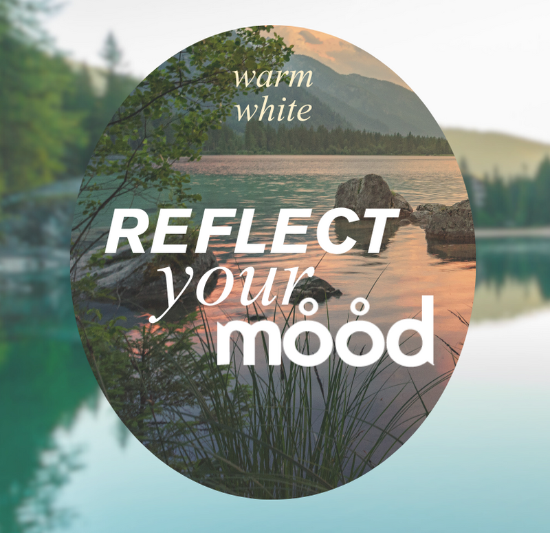 Scenic view of a lake with mountains and trees, featuring text overlay promoting 'Reflect Your Mood' lighting.